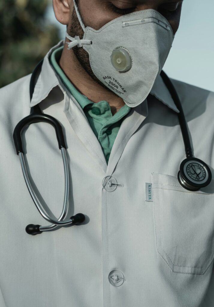 A doctor in a white coat with a stethoscope