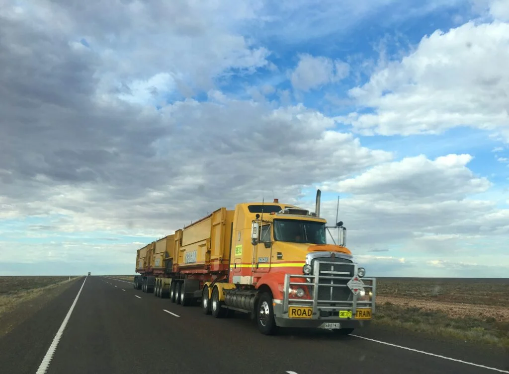 A tractor-trailer on an open highway