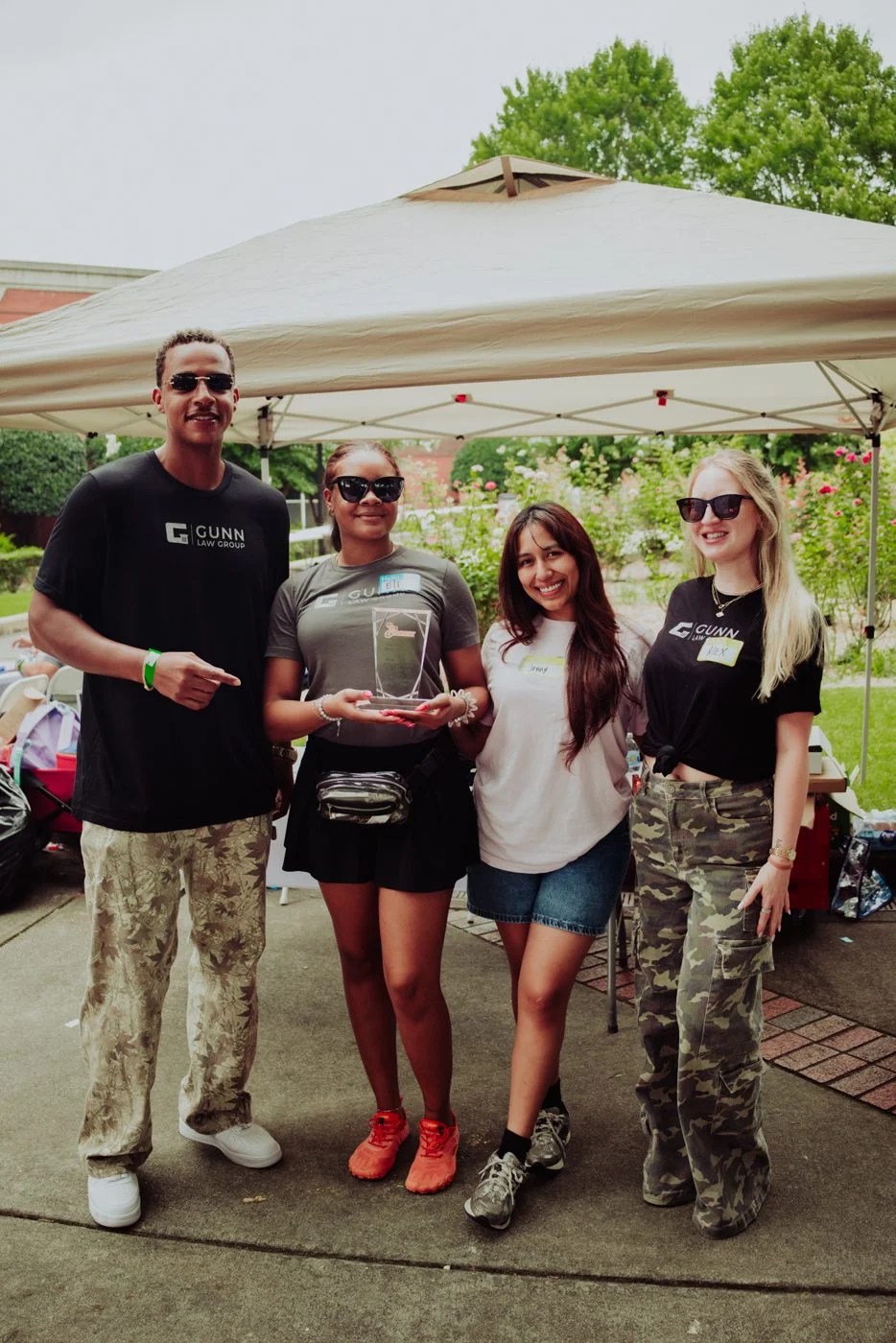 Gunn Law Group team members holding Ebenezer Baptist Church community service recognition