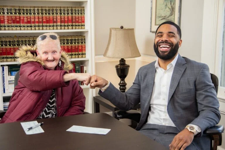 Harrell Gunn sharing a fist bump with a client