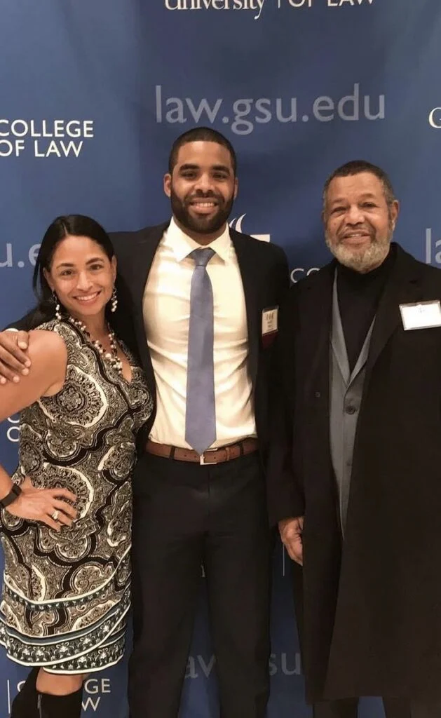 Harrell Gunn with his parents at Georgia State University College of Law